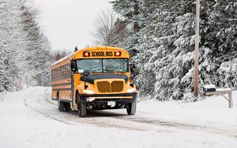 School bus driving in harsh conditions.